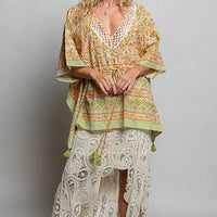 Coral floral tie-front blouse with V-neck and gathered waist, tassel ties at hem