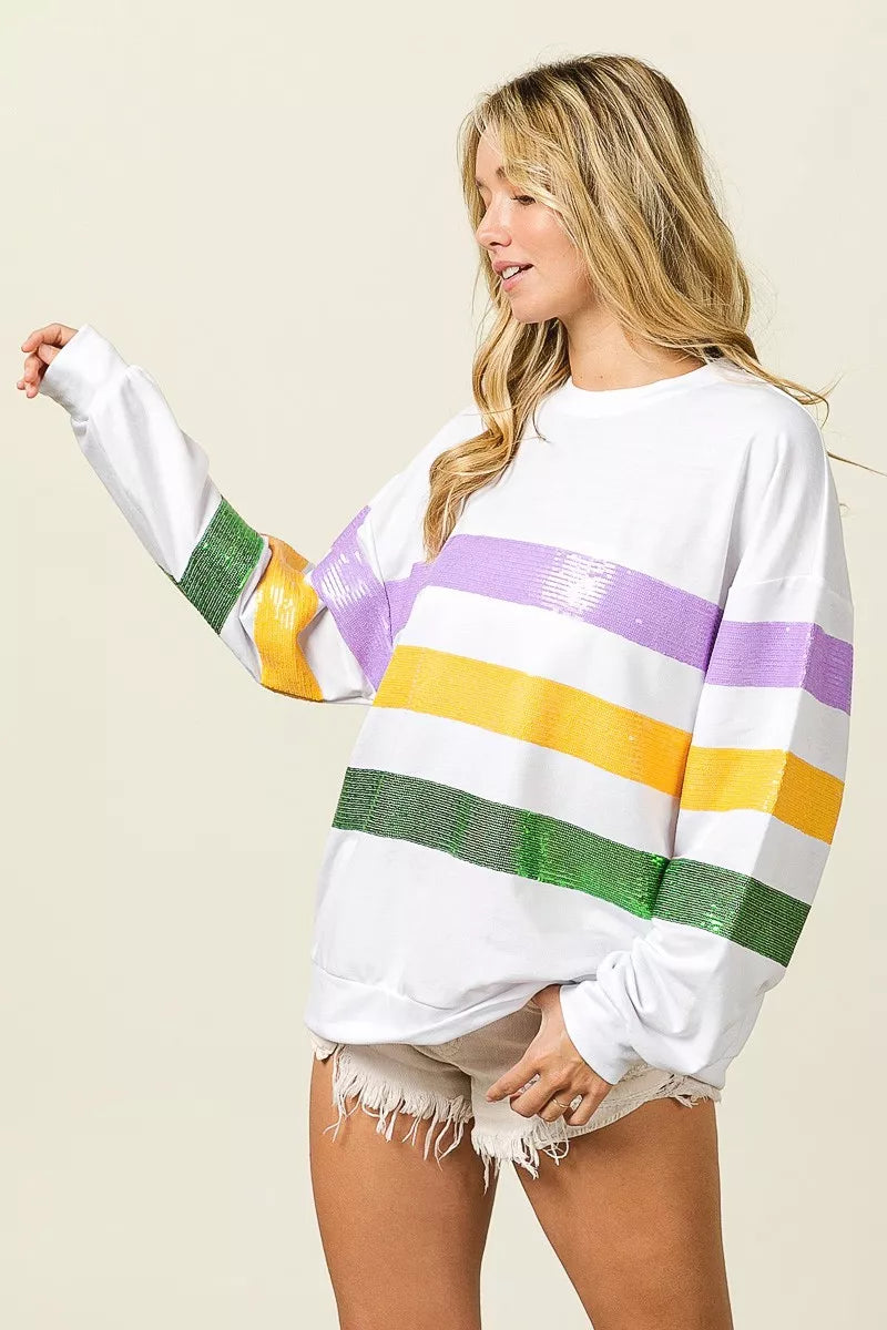 Off-white sweatshirt with sequined purple, yellow, and green striped sleeves