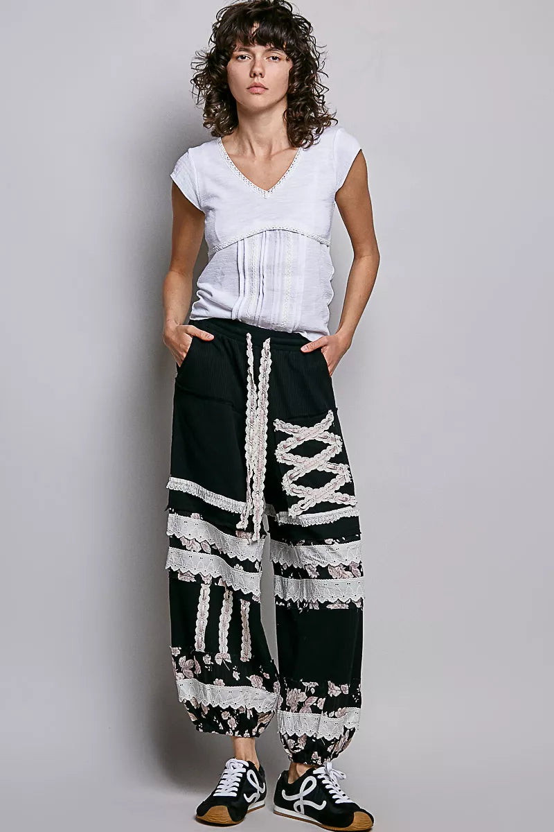 Off-white textured knit V-neck short-sleeve top with lace-trimmed neckline