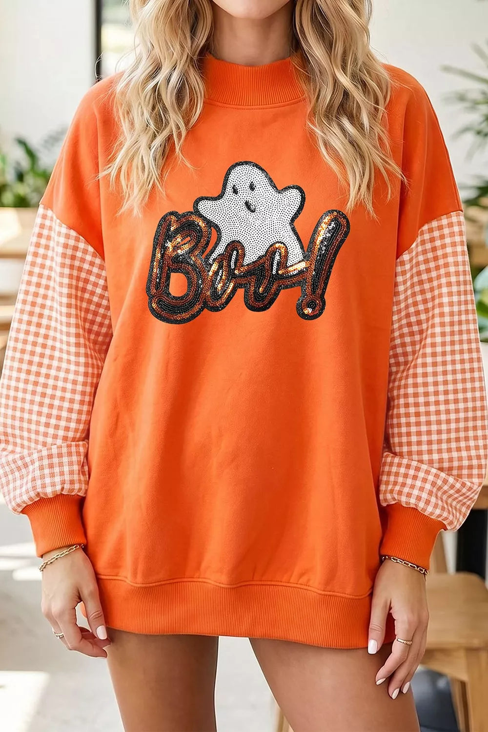 Orange Halloween sweatshirt with plaid patchwork sleeves and sequin ghost Boo graphic