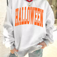 Light gray sweatshirt with large orange “HALLOWEEN” text, mock neck