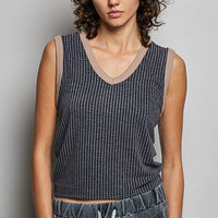Dark ribbed V-neck sleeveless tank with contrast trim and sleeveless cut
