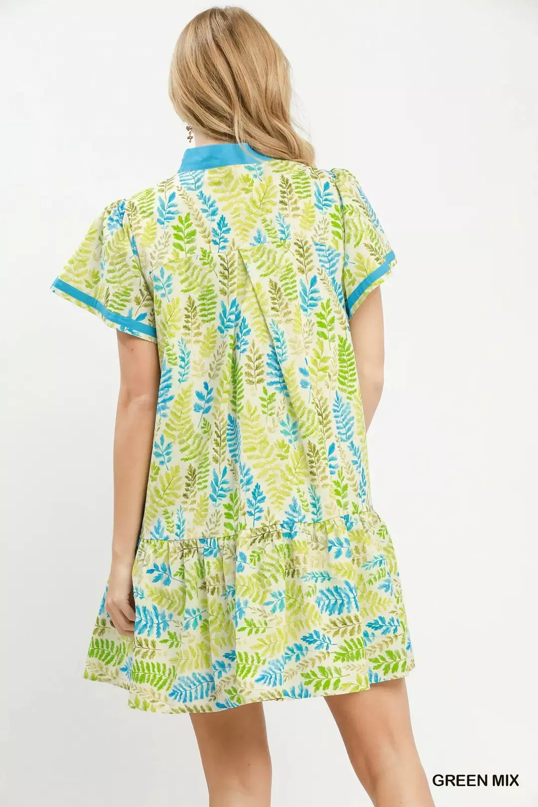 Green and blue leaf print tiered mini dress with flutter sleeves, back view