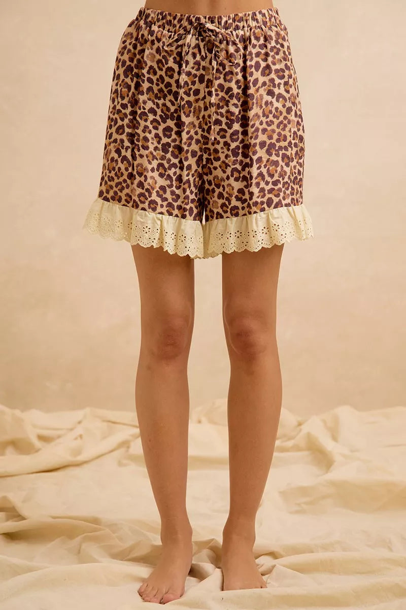 Leopard print shorts with drawstring waist and scalloped eyelet lace hem