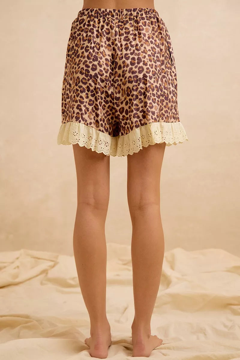 Leopard print drawstring shorts with scalloped eyelet lace trim at hem