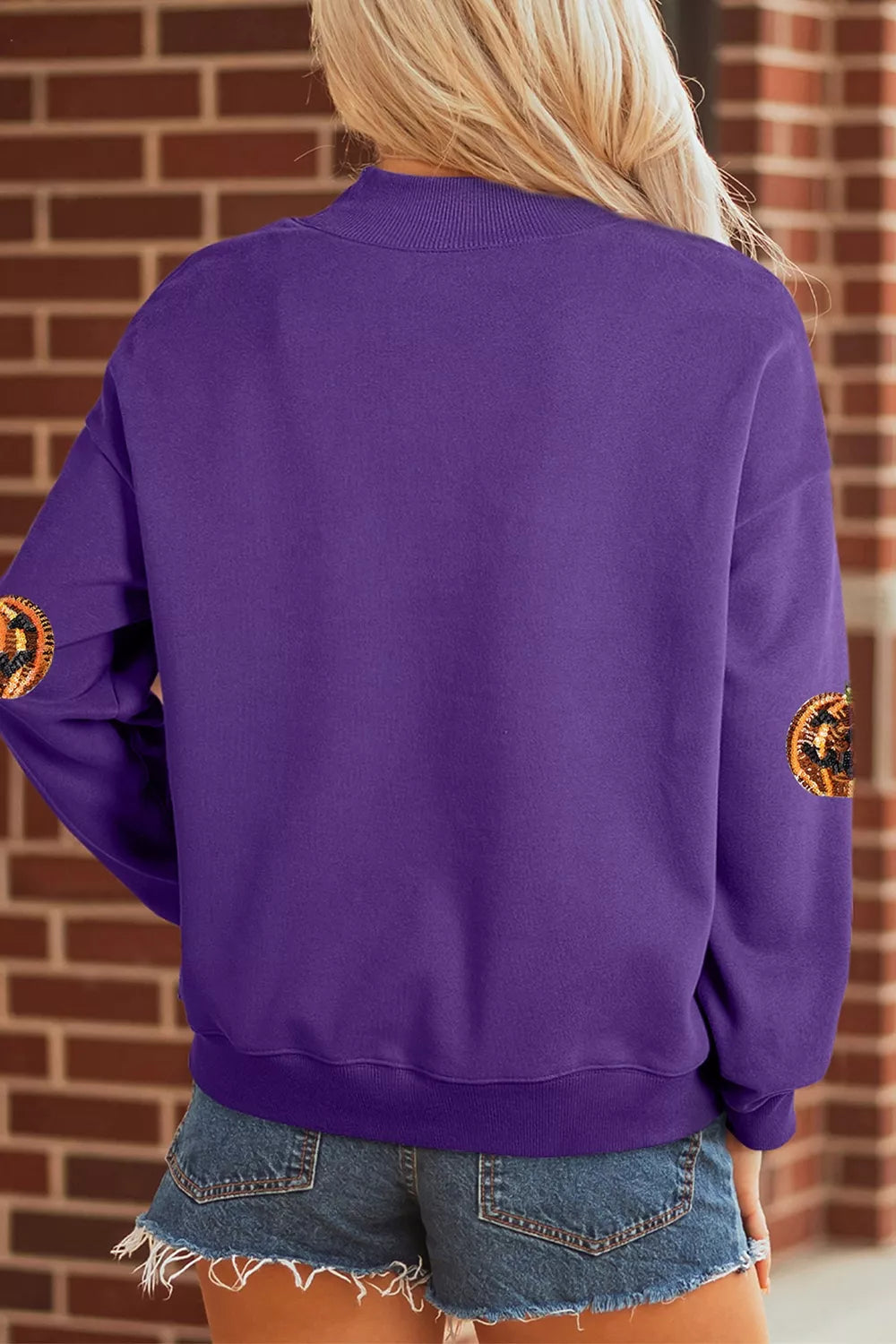Violet Halloween sweatshirt back view with pumpkin sequin patches