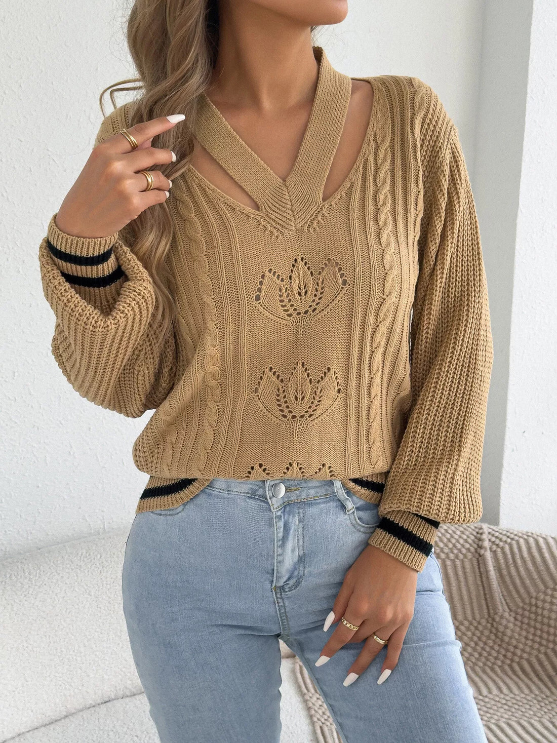 Camel V-neck cutout cable knit sweater with knit floral motifs