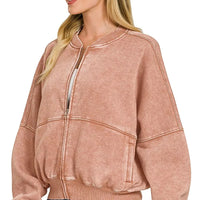 Rust acid-washed fleece zip jacket with kangaroo-style front pocket and ribbed cuffs