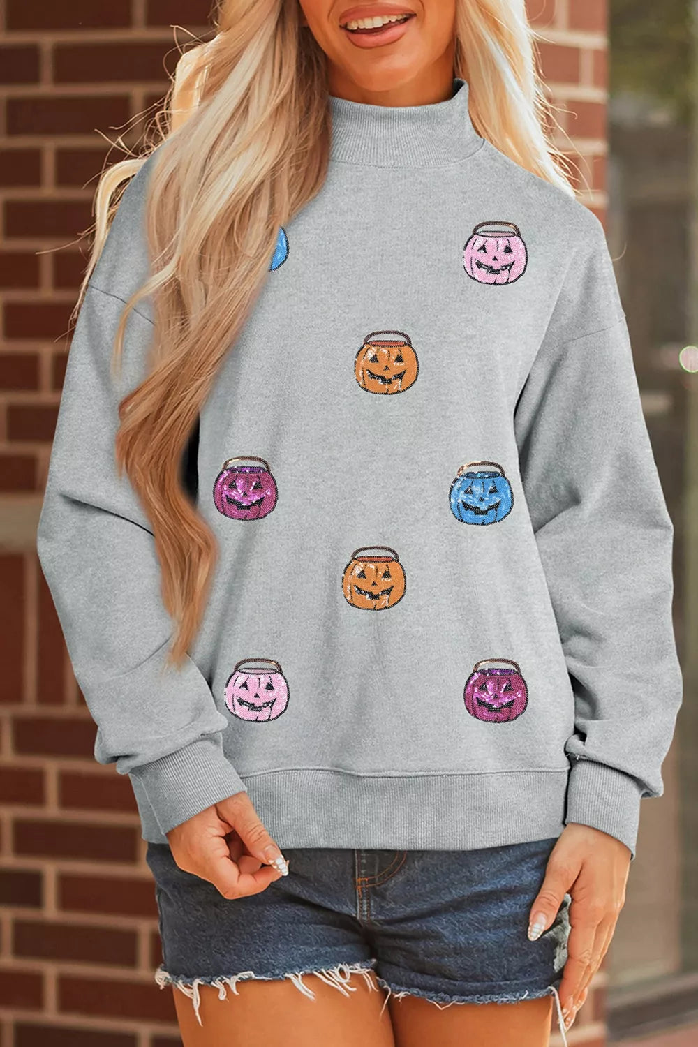 Gray long-sleeve sweatshirt with cartoon jack-o&