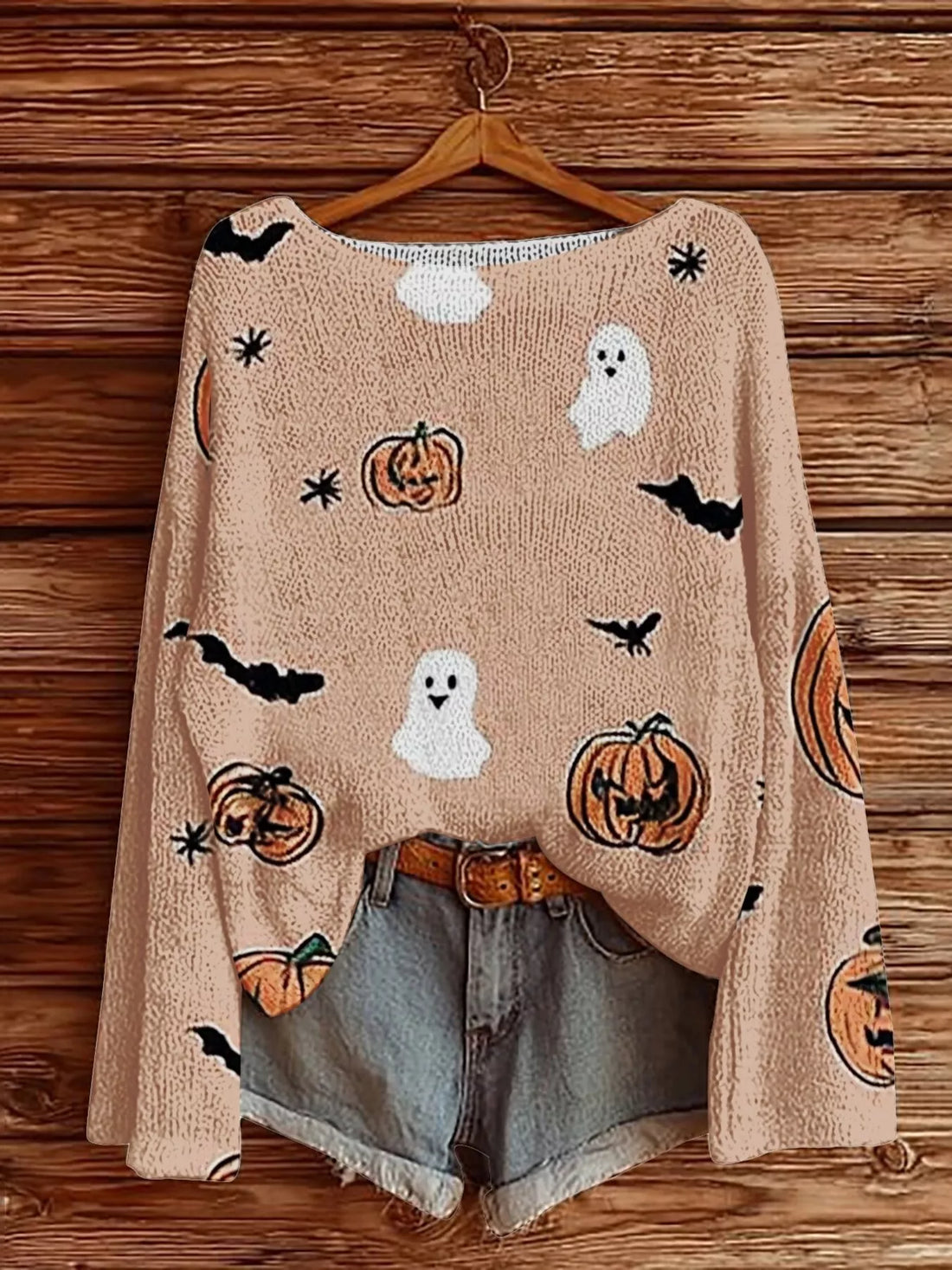 Plus-size Halloween boat-neck sweater in pale blush with ghost, pumpkin, bat graphics