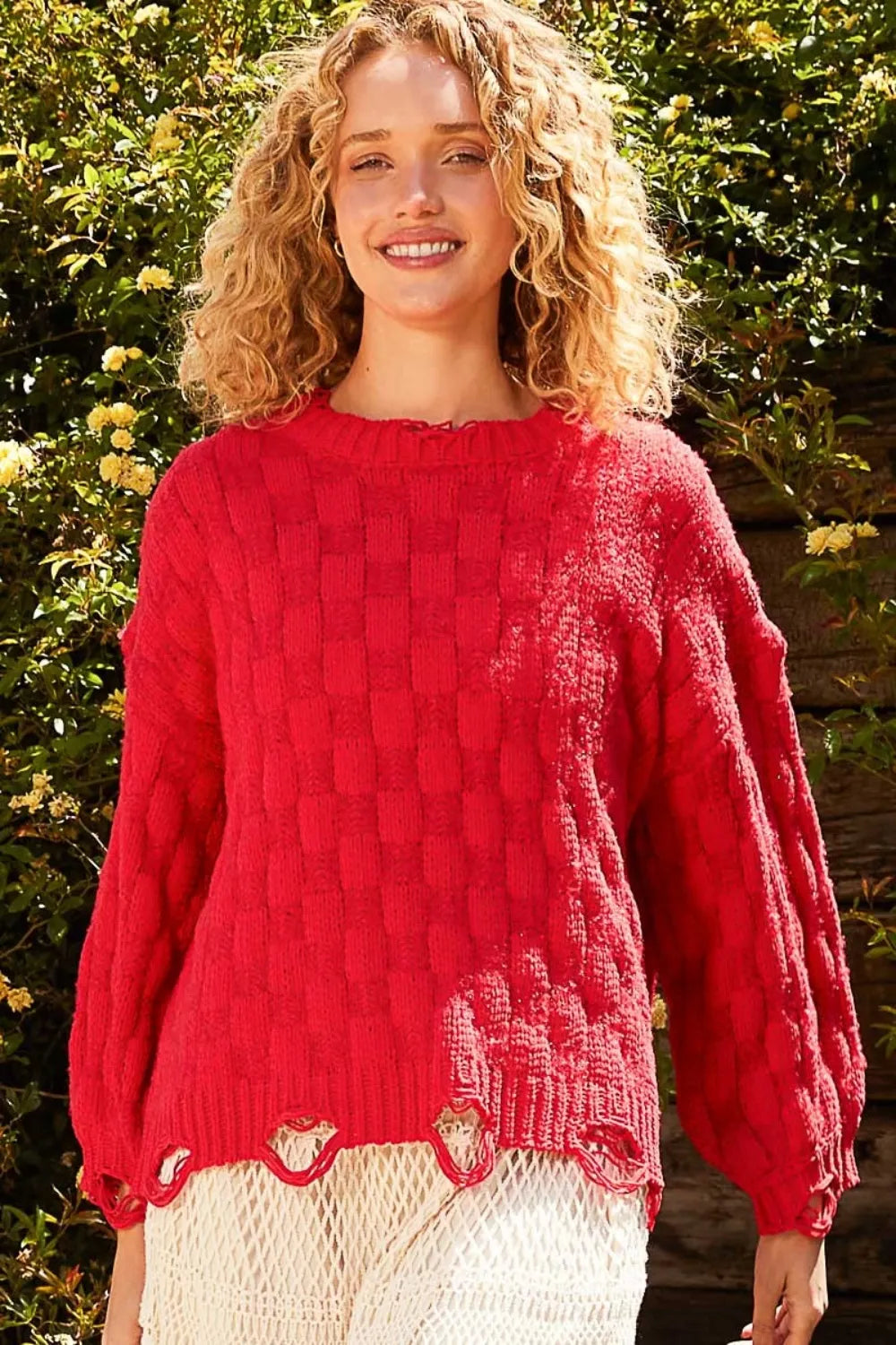Red checkered distressed edge sweater with scalloped hem and knit texture