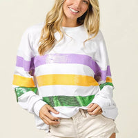 Off-white round-neck sweatshirt with sequined horizontal purple, yellow, and green stripes