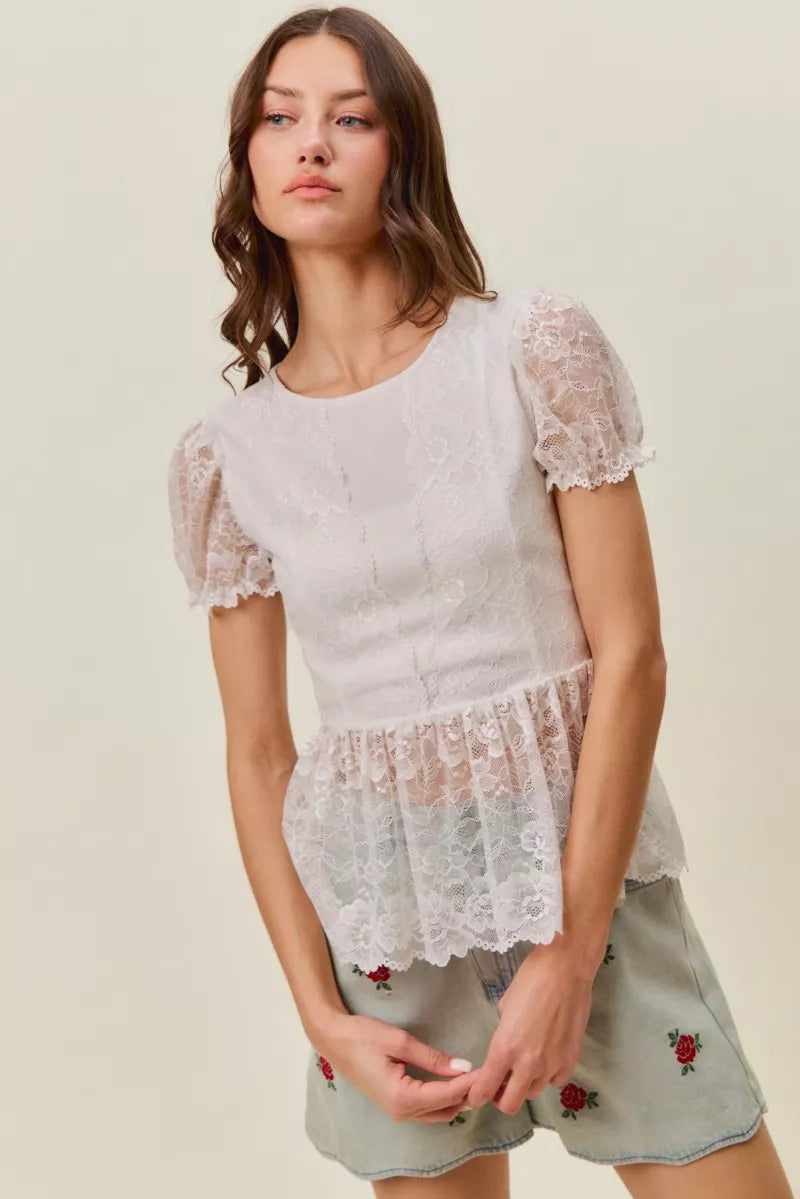 Light-wash denim shorts with rose embroidery shown on model