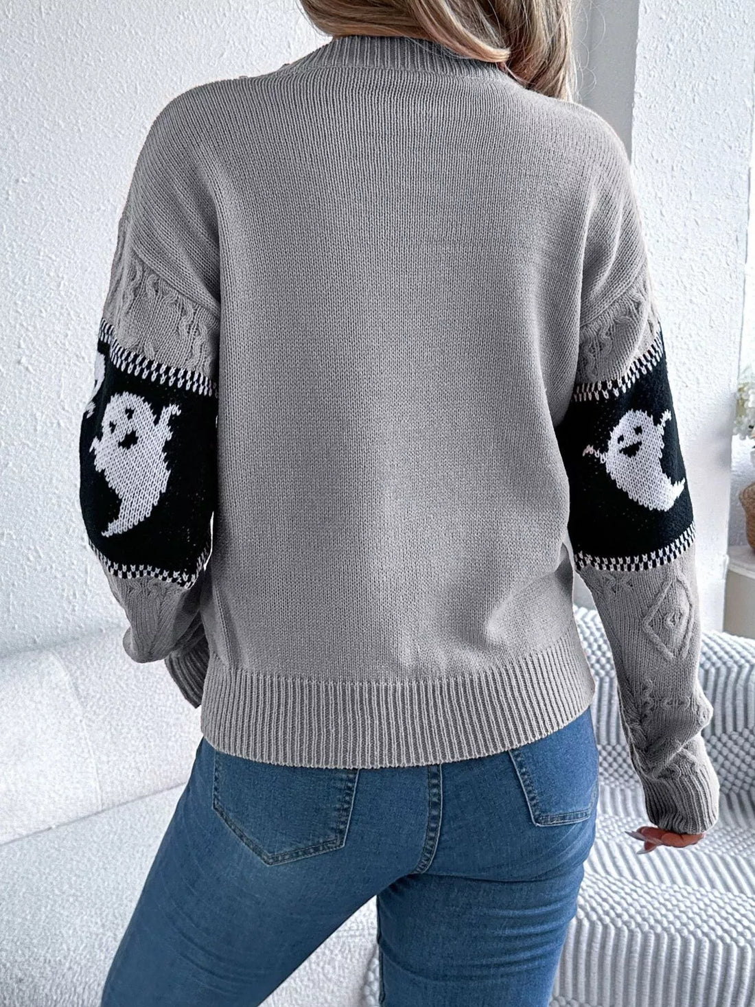 Gray textured knit sweater with ghost pattern sleeves and crew back