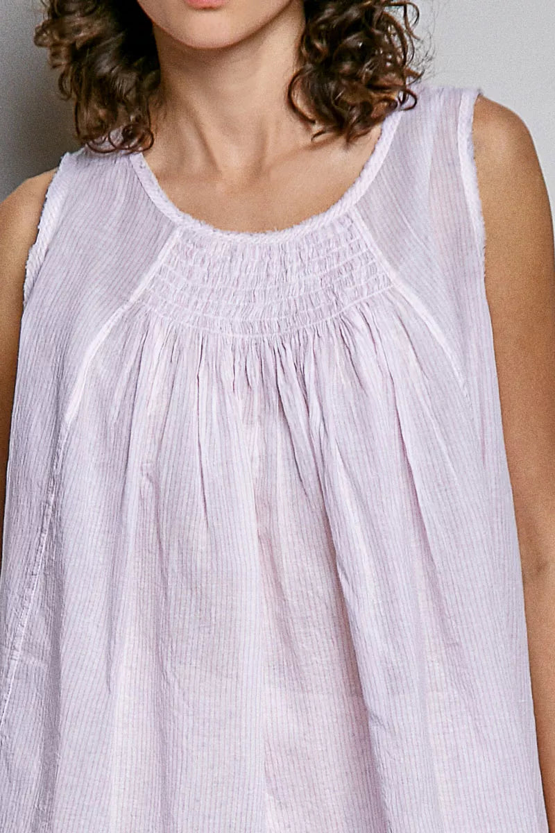 Lavender sleeveless cotton top close-up with round neck and gathered pleats