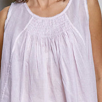 Lavender sleeveless cotton top close-up with round neck and gathered pleats