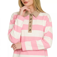 Pink and white striped polo top with contrast brown collar and button placket