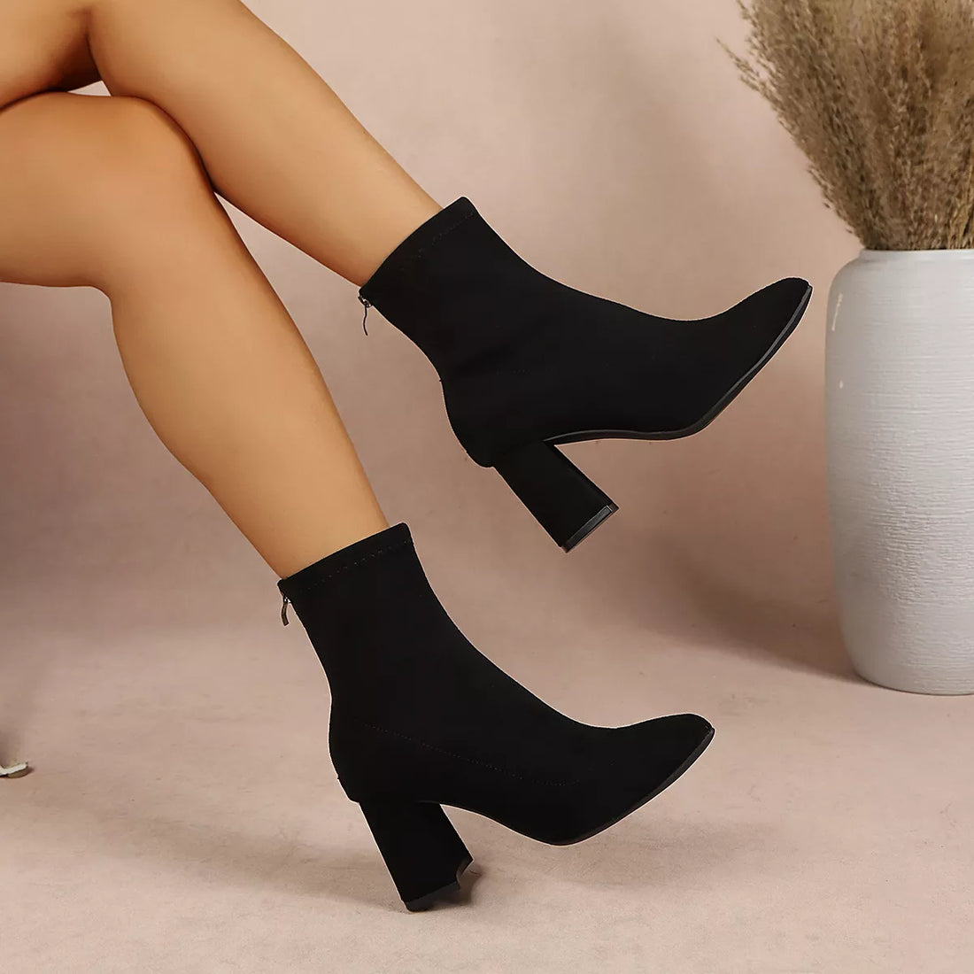 Black point-toe block-heel ankle boots, side view with thick stacked heel