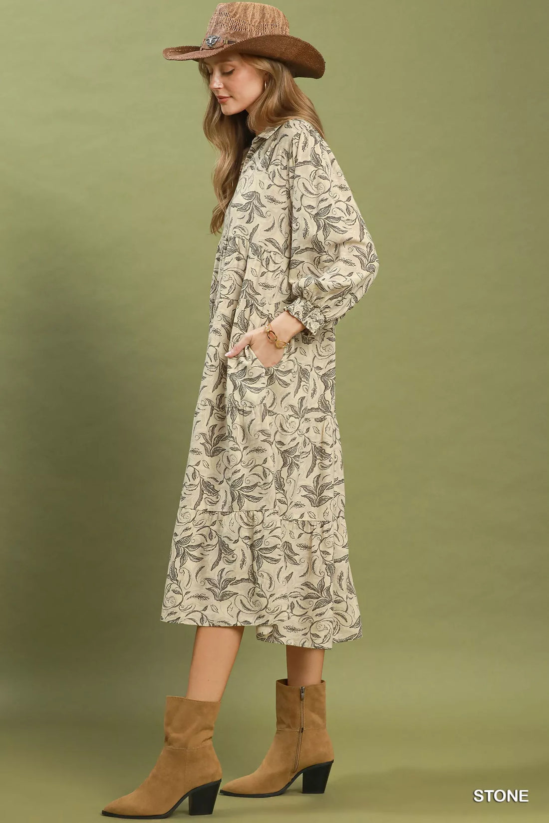 Beige botanical-print tiered midi dress shown in side view with long sleeves
