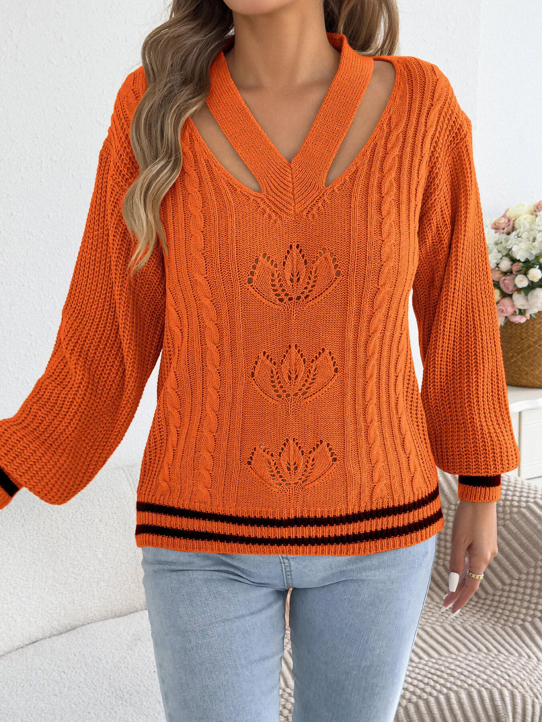 Orange V-neck cutout cable knit sweater, striped hem and cuffs