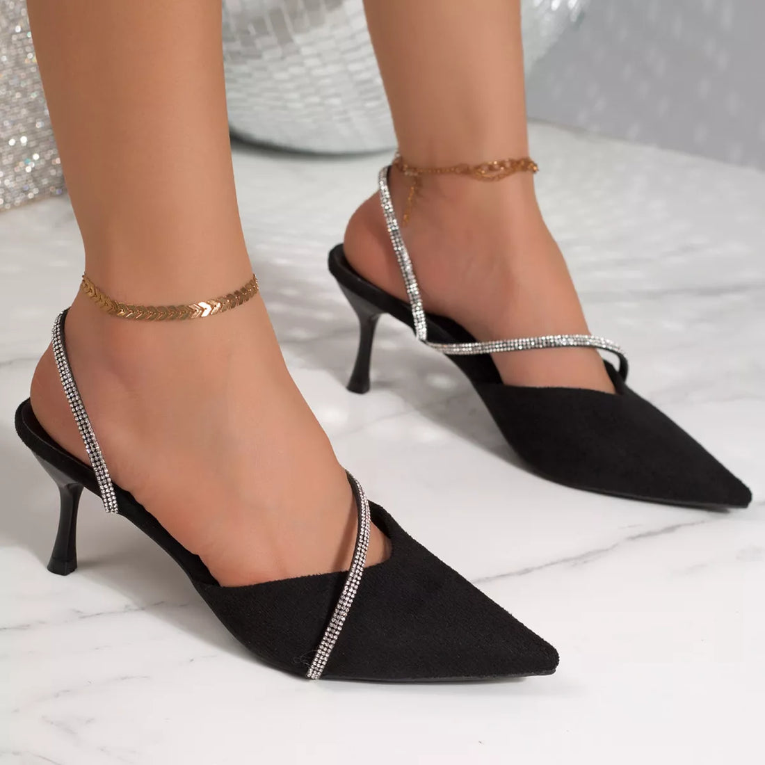 Black suede point-toe kitten heel sandals with rhinestone ankle straps and slingback