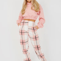 Pink and white checked joggers with elastic cuffs and drawstring waist