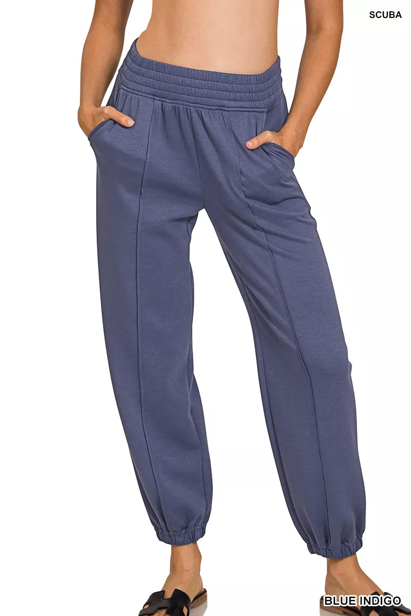 Indigo-blue scuba joggers with elastic waist and side pockets, ankle cuffs