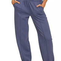 Indigo-blue scuba joggers with elastic waist and side pockets, ankle cuffs