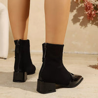 Black sock boots with block heel and side buckle hardware