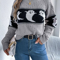 Gray textured knit sweater with black-and-white ghost pattern on the chest and sleeves