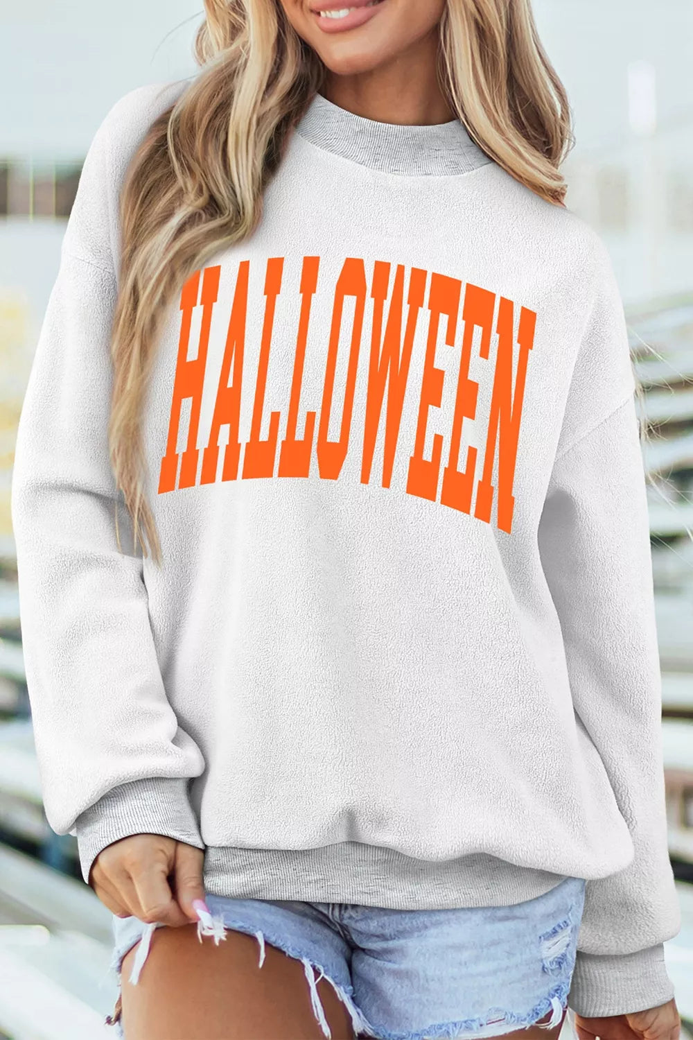 Light gray sweatshirt with bold orange “HALLOWEEN” text at center