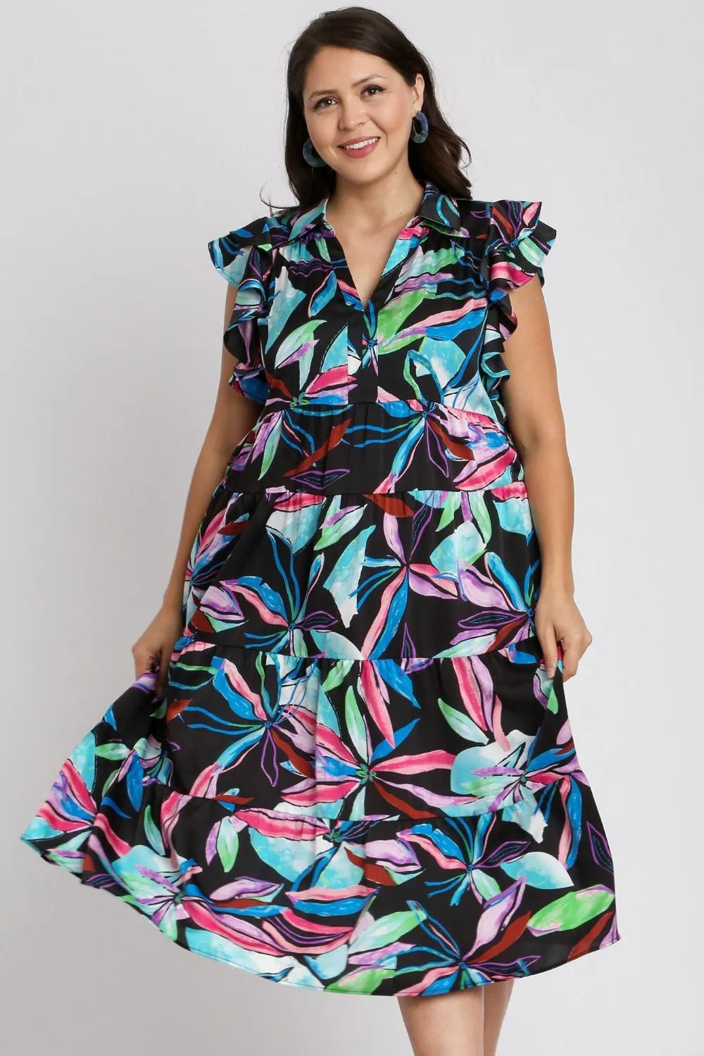 Plus size midi dress with gathered tiers, ruffled sleeves, and multicolor leaf print.