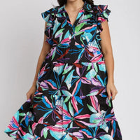 Plus size midi dress with gathered tiers, ruffled sleeves, and multicolor leaf print.