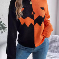 Two-tone pumpkin face graphic sweater, orange/black zip-front knit, long sleeves