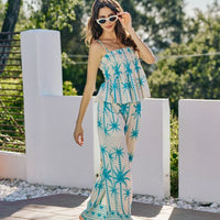 Women’s blue palm-print smocked cami top with adjustable straps and tiered peplum