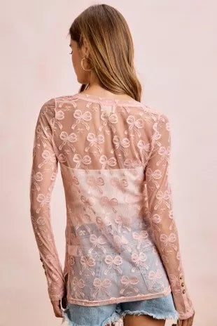 Dusty rose sheer mesh cardigan with bow-pattern print on the back, long sleeves, button front
