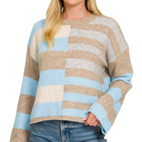 Lightweight color block sweater with sky blue sleeves and beige, white stripe blocks