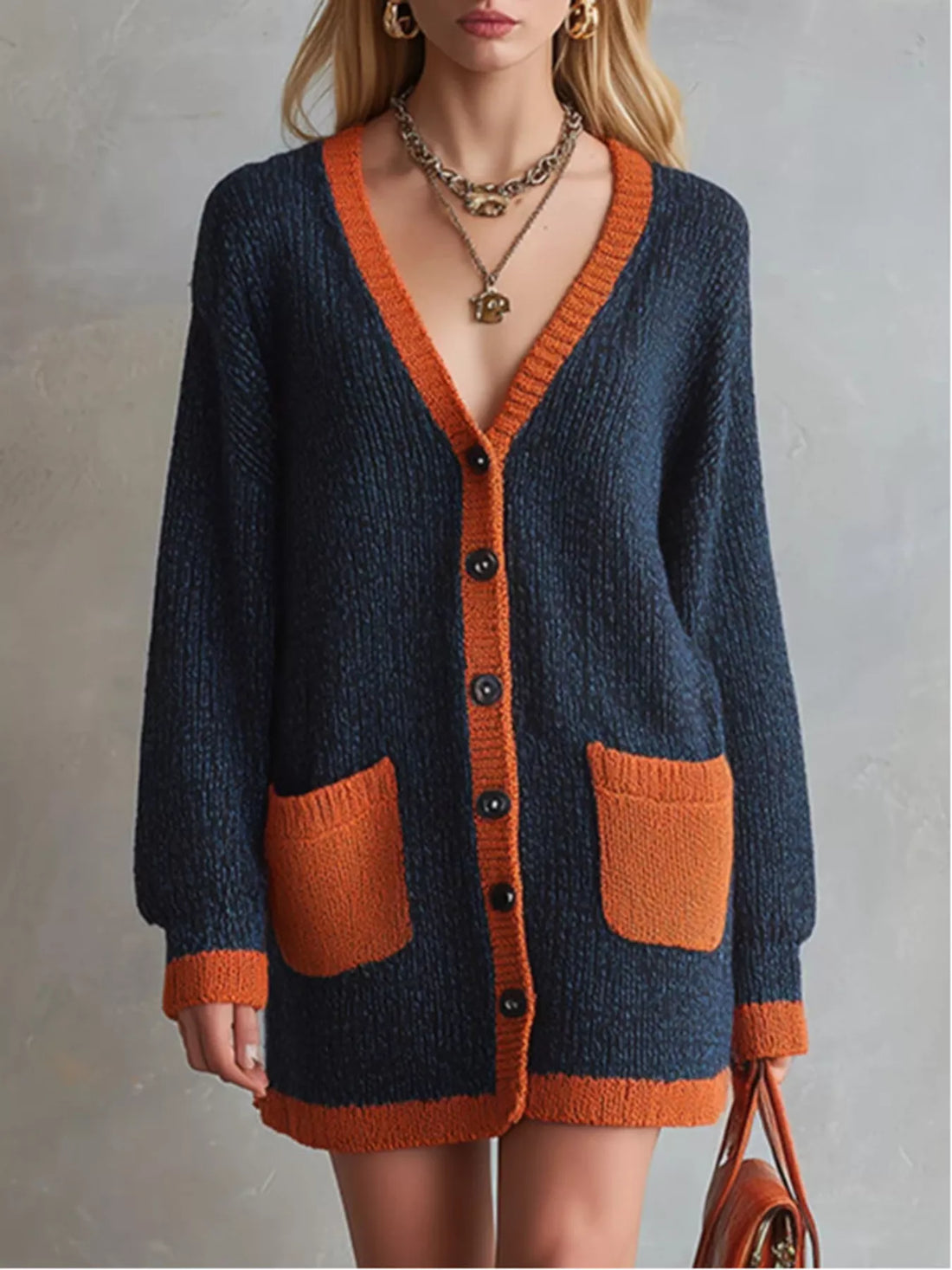 Dark navy color-block V-neck button cardigan with orange placket and patch pockets
