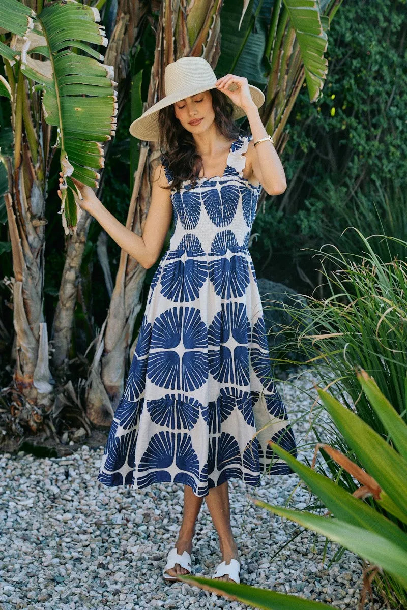Navy and white abstract print sleeveless midi dress with smocked bodice and tiered skirt