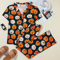 Flat lay of dark green pumpkin-printed short-sleeve top and lounge pants set