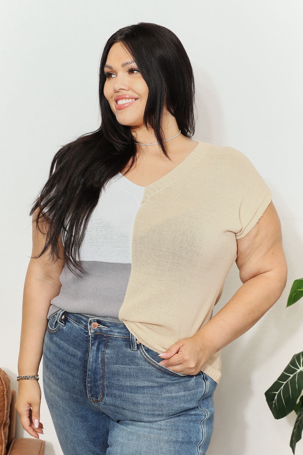 Color-block knit top with V-neck and short sleeves; beige, white, and gray color panels