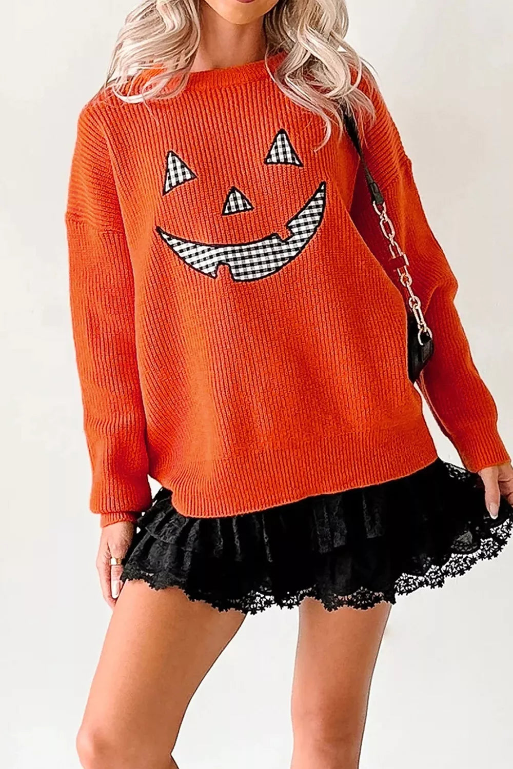 Orange drop-shoulder sweater with jack-o-lantern print and round crew neck