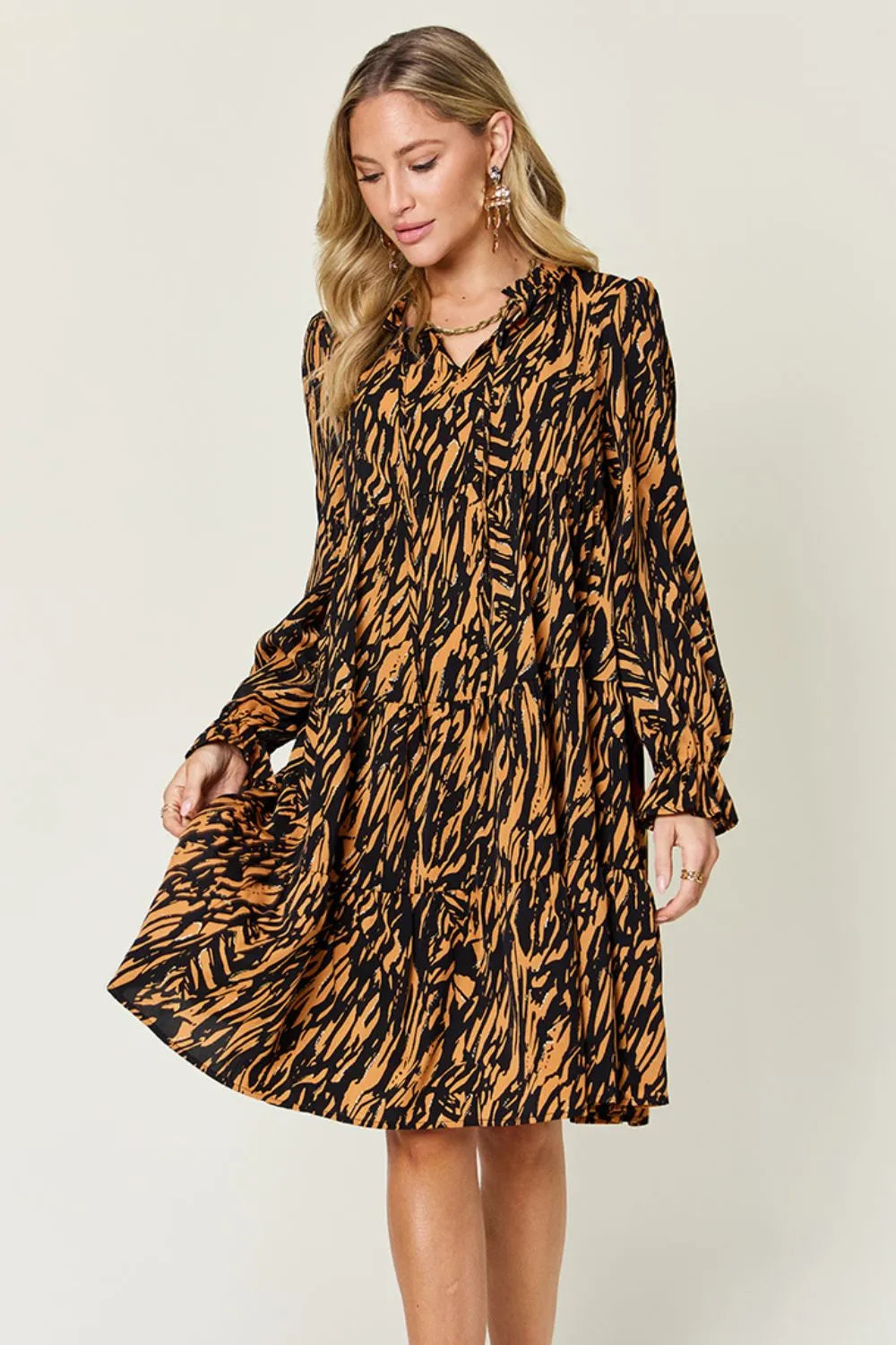 Caramel and black animal-print long-sleeve dress with tiered ruffle hem