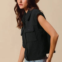 Black quilted knit button-up vest with flap chest pocket and button front