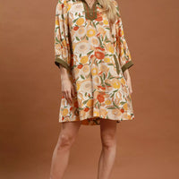 Floral shift mini dress with olive contrast trim, three-quarter sleeves, and mini length