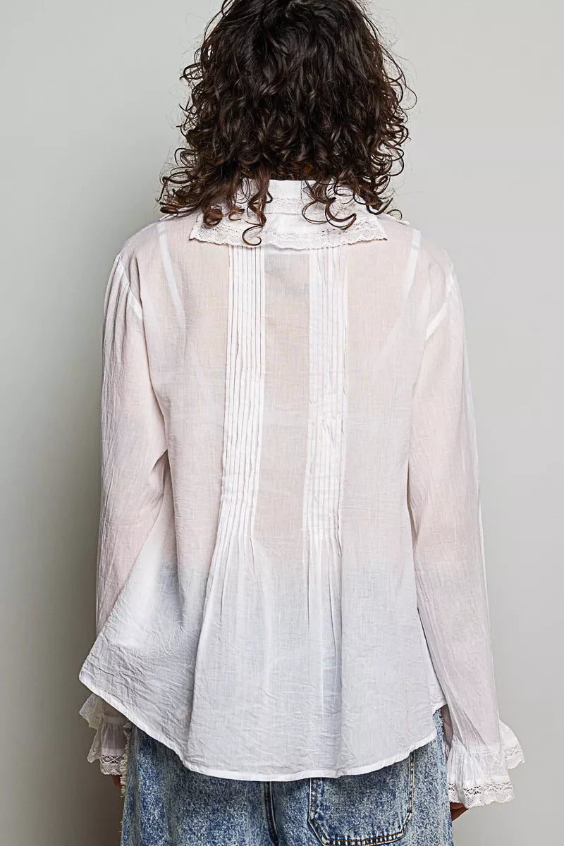 Ivory back view button-down shirt with pintuck seams and lace-trim hem