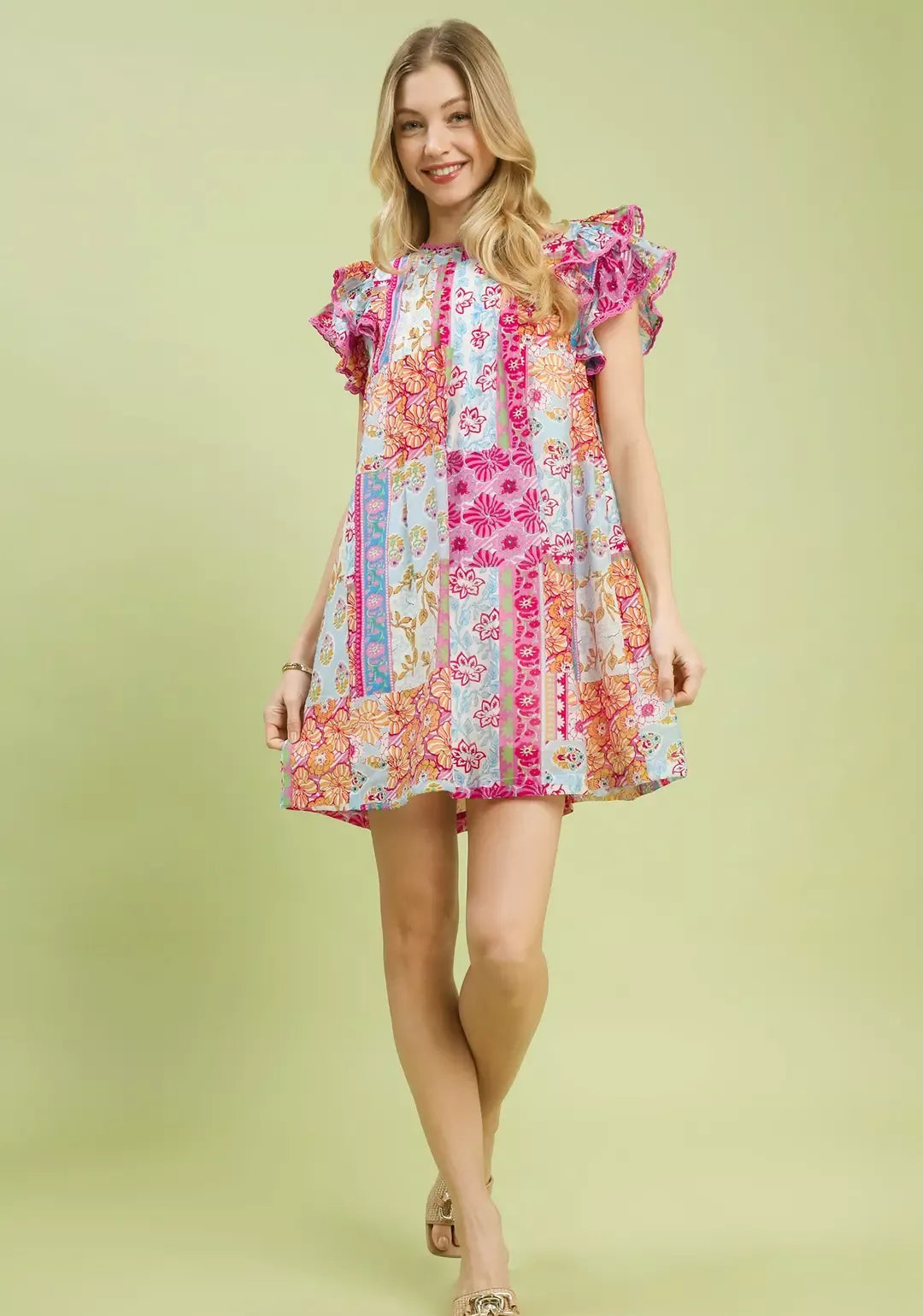Pink patchwork mini dress with ruffled flutter sleeves and short hem