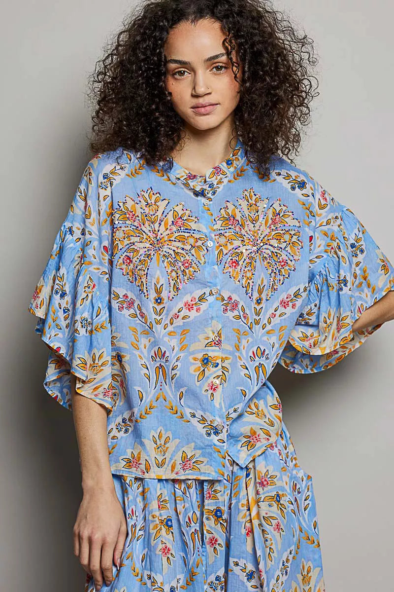 Blue floral printed woven ruffle-sleeve shirt with loose fit and elastic waist, front