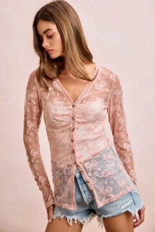 Dusty rose sheer mesh cardigan top with bow pattern, V-neck, button front and side slit