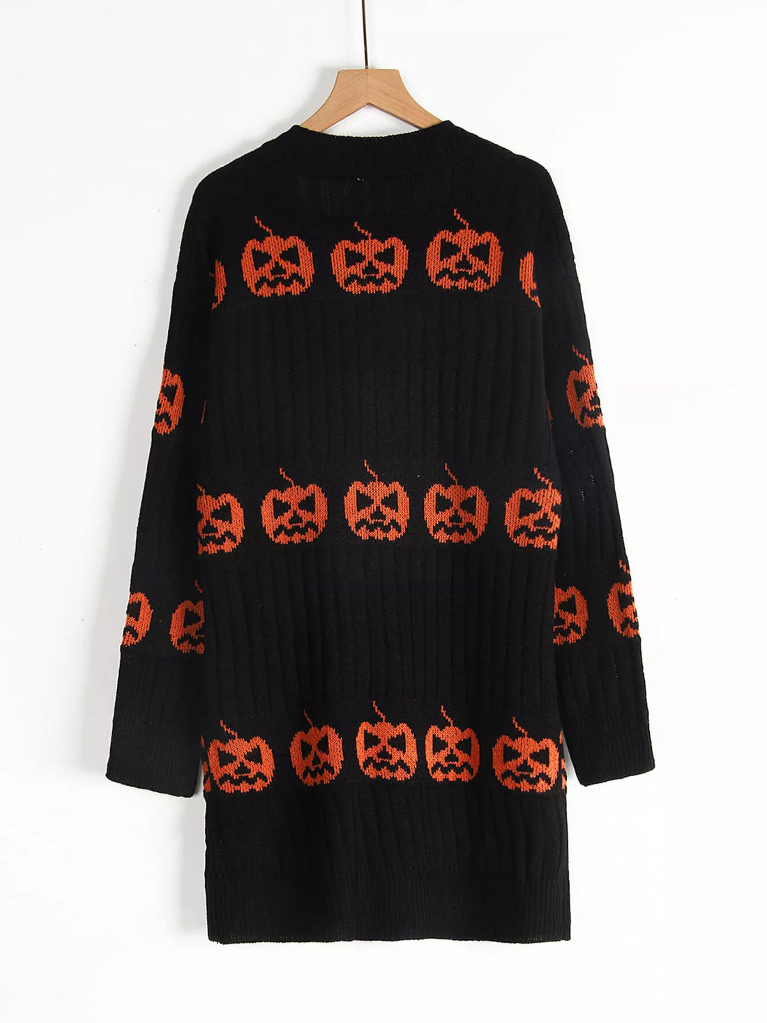 Black open-front knit cardigan featuring orange pumpkin jack-o&